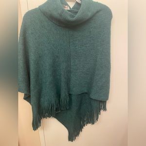 Chico’s one-size asymmetrical poncho w/cowl neck& fringe hemline. Acrylic poly.